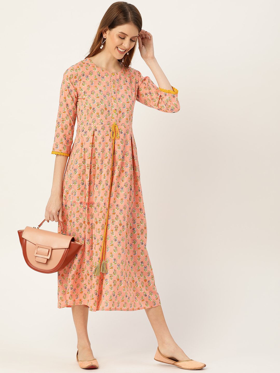 Women Peach Ethnic Motifs Printed Round Neck Cotton Maxi Dress | LASVINI - Redefining Indian Fashion with Elegance