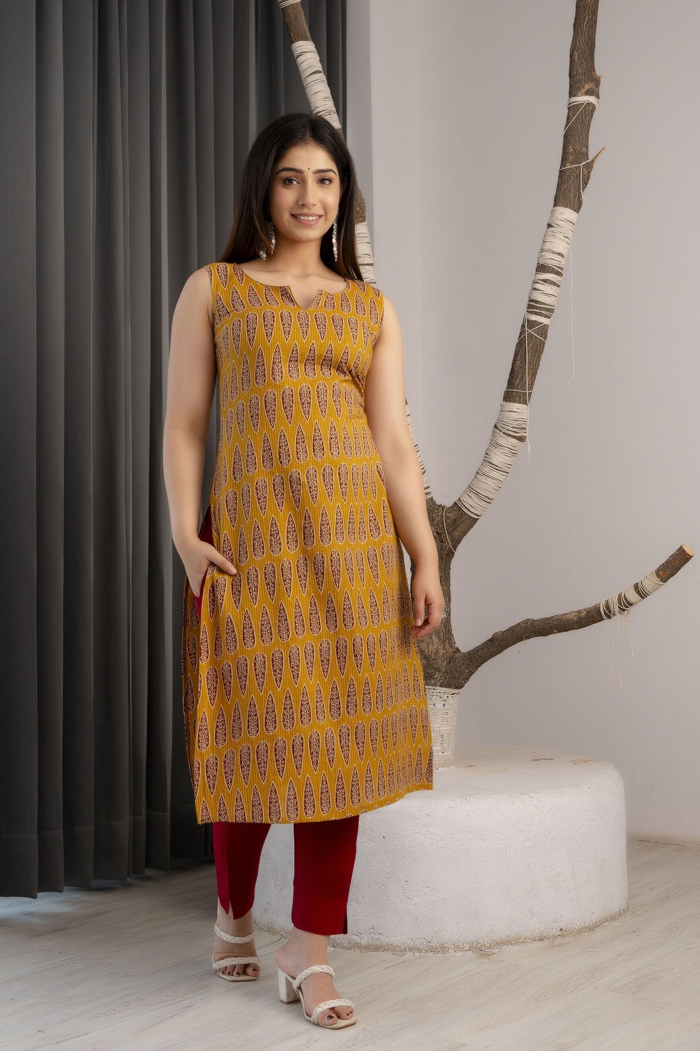 Women Mustard Printed Straight Sleeveless Kurta | LASVINI - Redefining Indian Fashion with Elegance