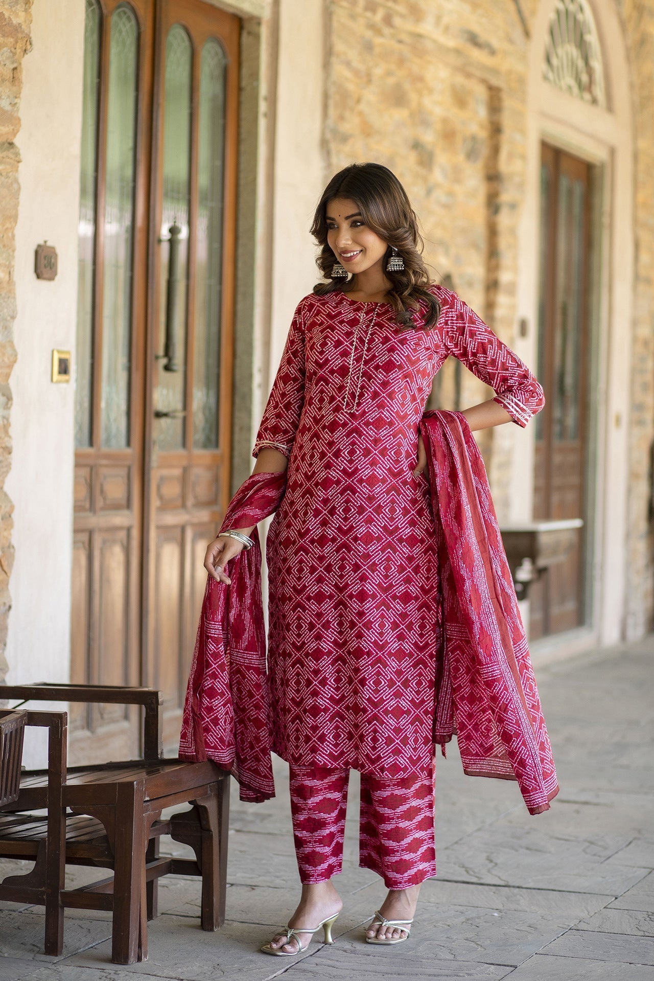Women Red Bandhani Printed Straight Kurta With Palzzo And Dupatta | LASVINI - Redefining Indian Fashion with Elegance