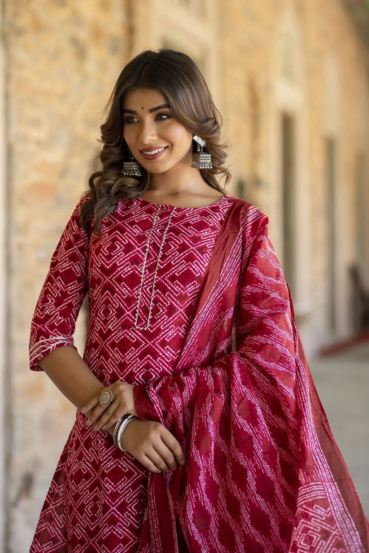 Women Red Bandhani Printed Straight Kurta With Palzzo And Dupatta | LASVINI - Redefining Indian Fashion with Elegance