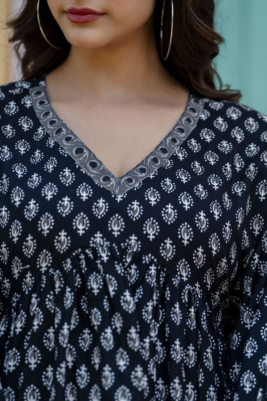 Women Black Printed V-Neck Peplum Tunic | LASVINI - Redefining Indian Fashion with Elegance