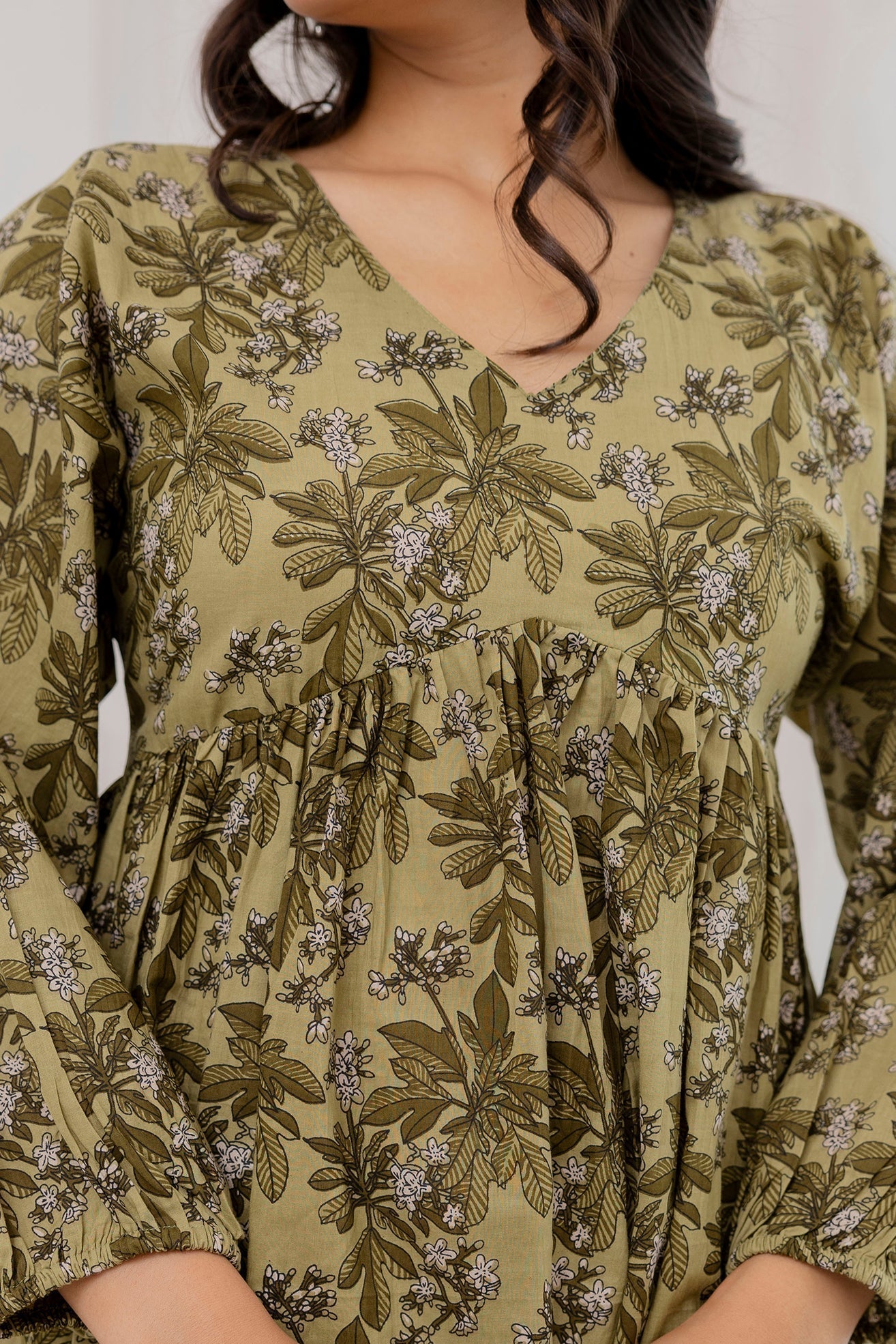 Women Green Printed V-Neck Peplum Tunic | LASVINI - Redefining Indian Fashion with Elegance