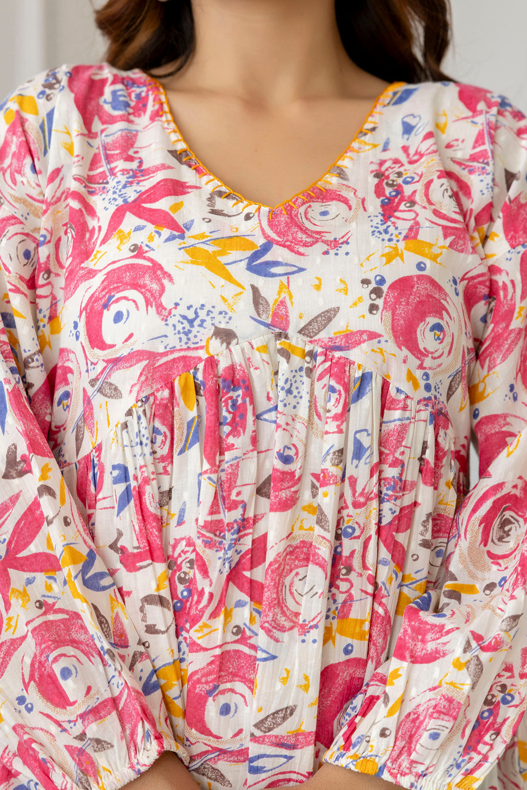 Women Pink And Off-White Printed V-Neck Peplum Tunic | LASVINI - Redefining Indian Fashion with Elegance