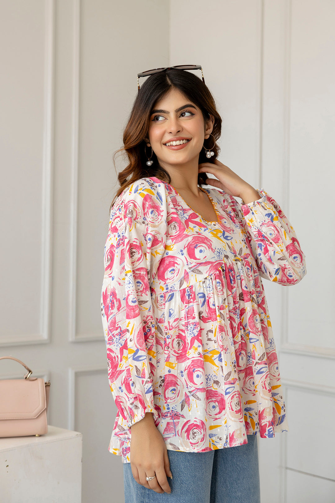 Women Pink And Off-White Printed V-Neck Peplum Tunic | LASVINI - Redefining Indian Fashion with Elegance