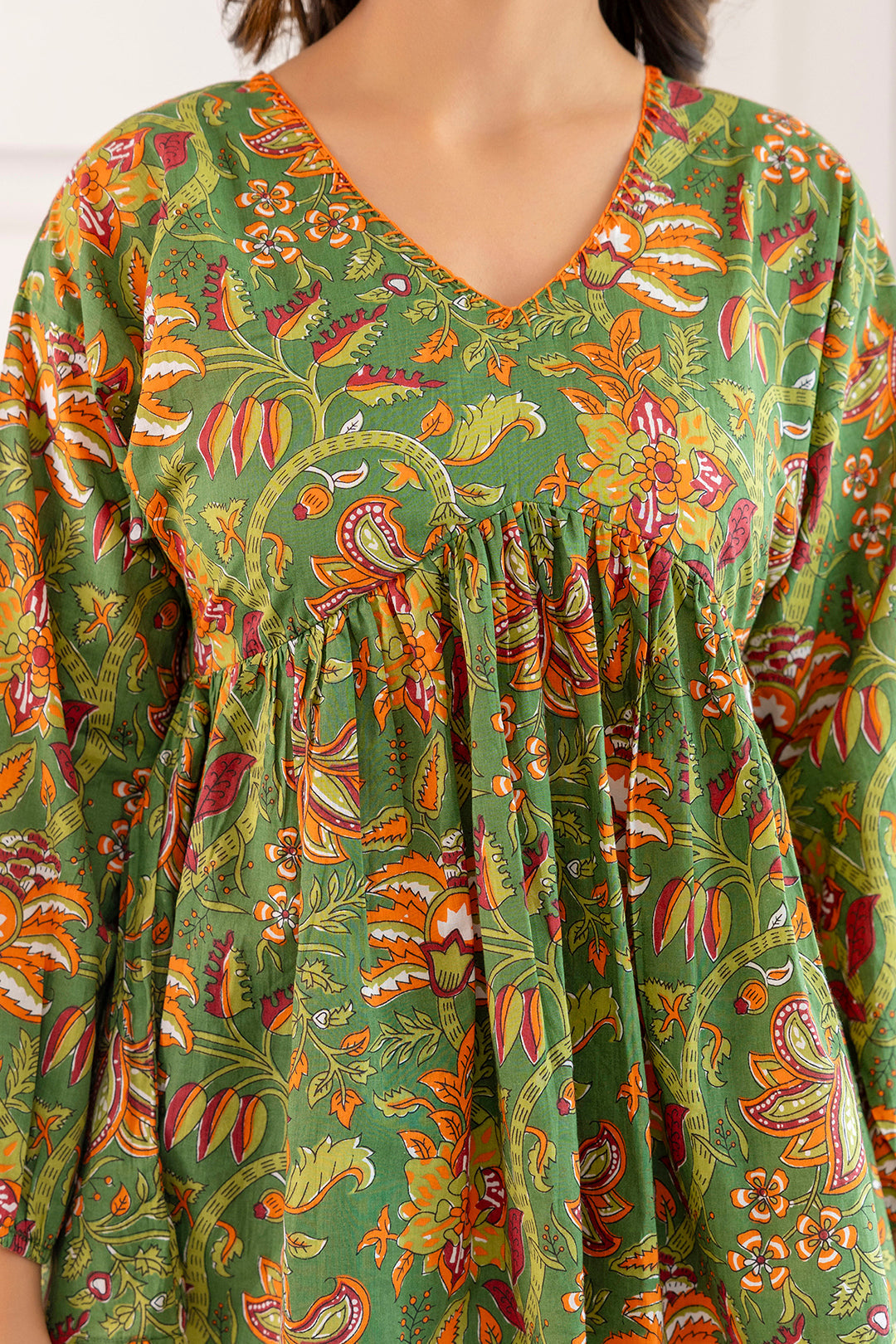 Women Green Printed V-Neck Peplum Tunic | LASVINI - Redefining Indian Fashion with Elegance
