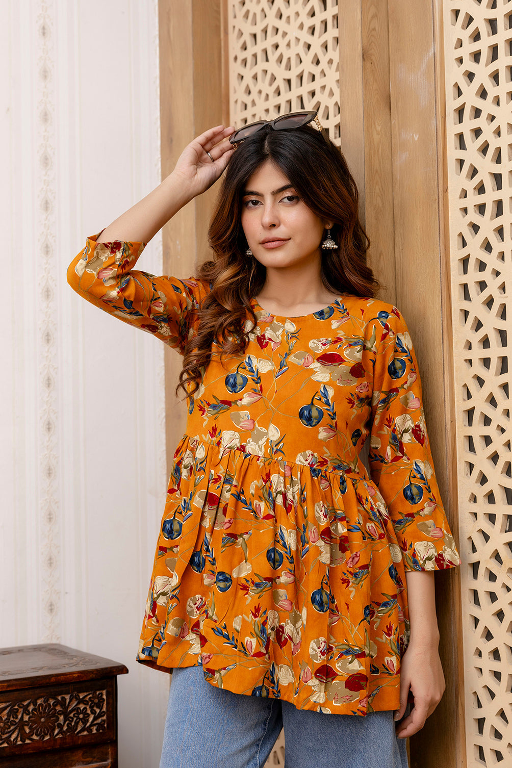 Women Mustard Printed V-Neck Peplum Tunic | LASVINI - Redefining Indian Fashion with Elegance