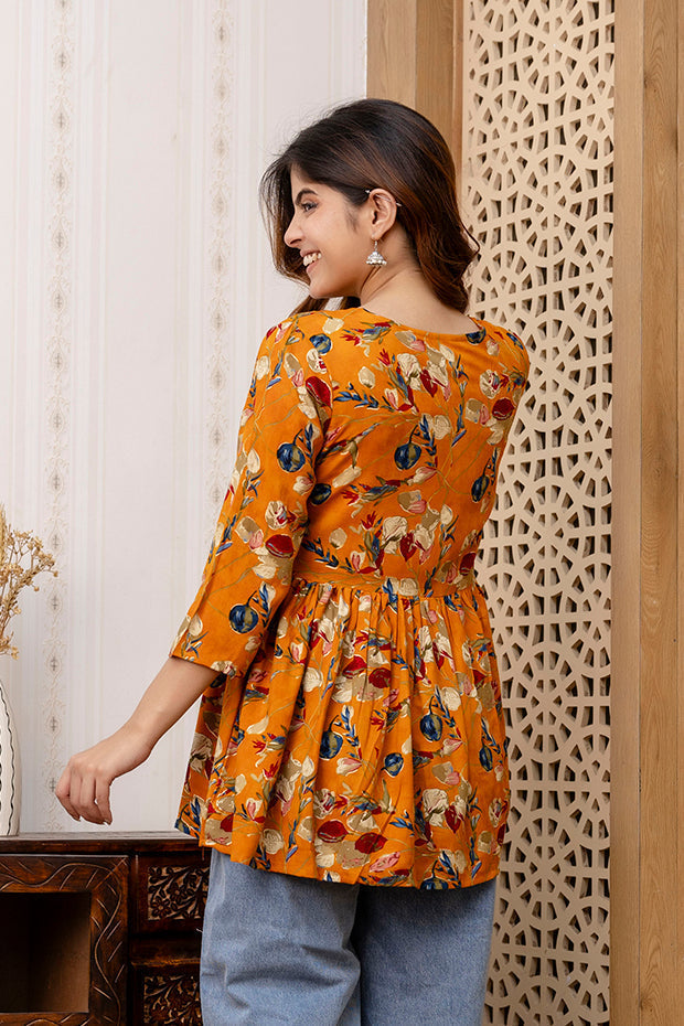 Women Mustard Printed V-Neck Peplum Tunic | LASVINI - Redefining Indian Fashion with Elegance