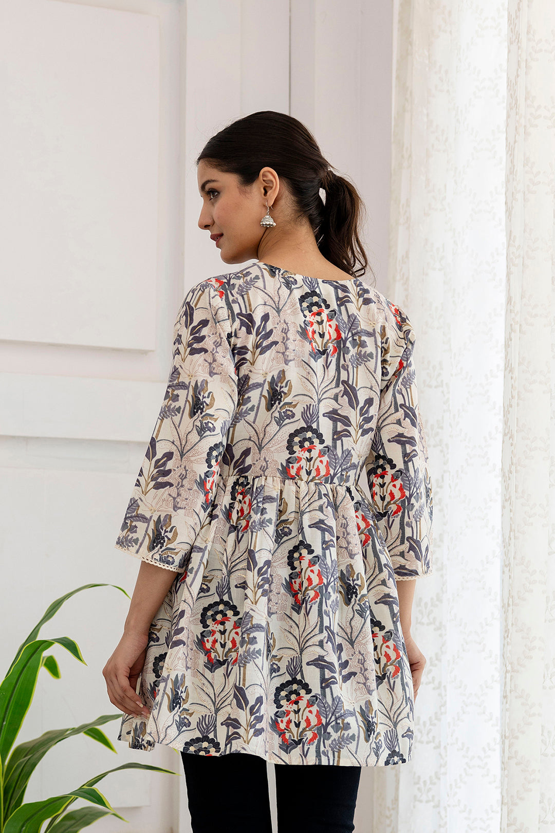 Women Off-White Printed V-Neck Peplum Tunic | LASVINI - Redefining Indian Fashion with Elegance