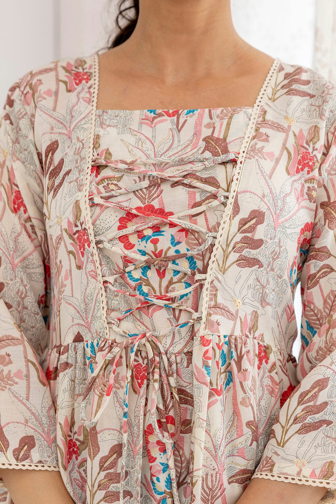 Women Off-White Printed V-Neck Peplum Tunic | LASVINI - Redefining Indian Fashion with Elegance