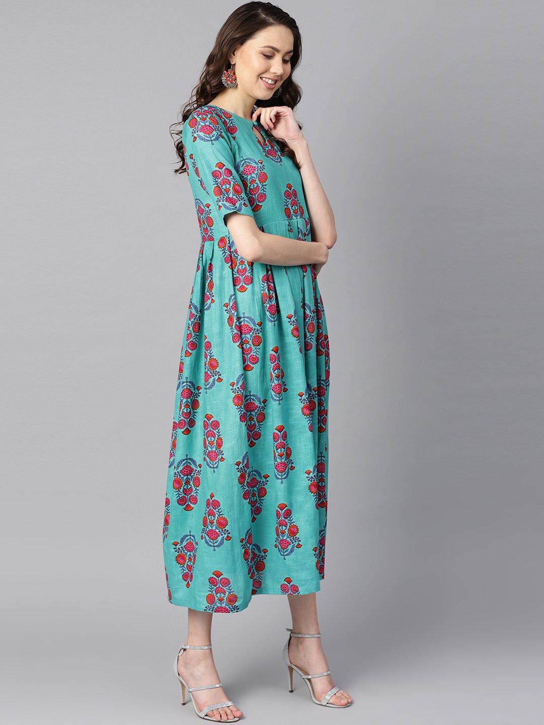 Turqish Blue Color Printed Half Sleeve Pleated Maxi Dress With Deep Back And Tassel Detailing. | LASVINI - Redefining Indian Fashion with Elegance