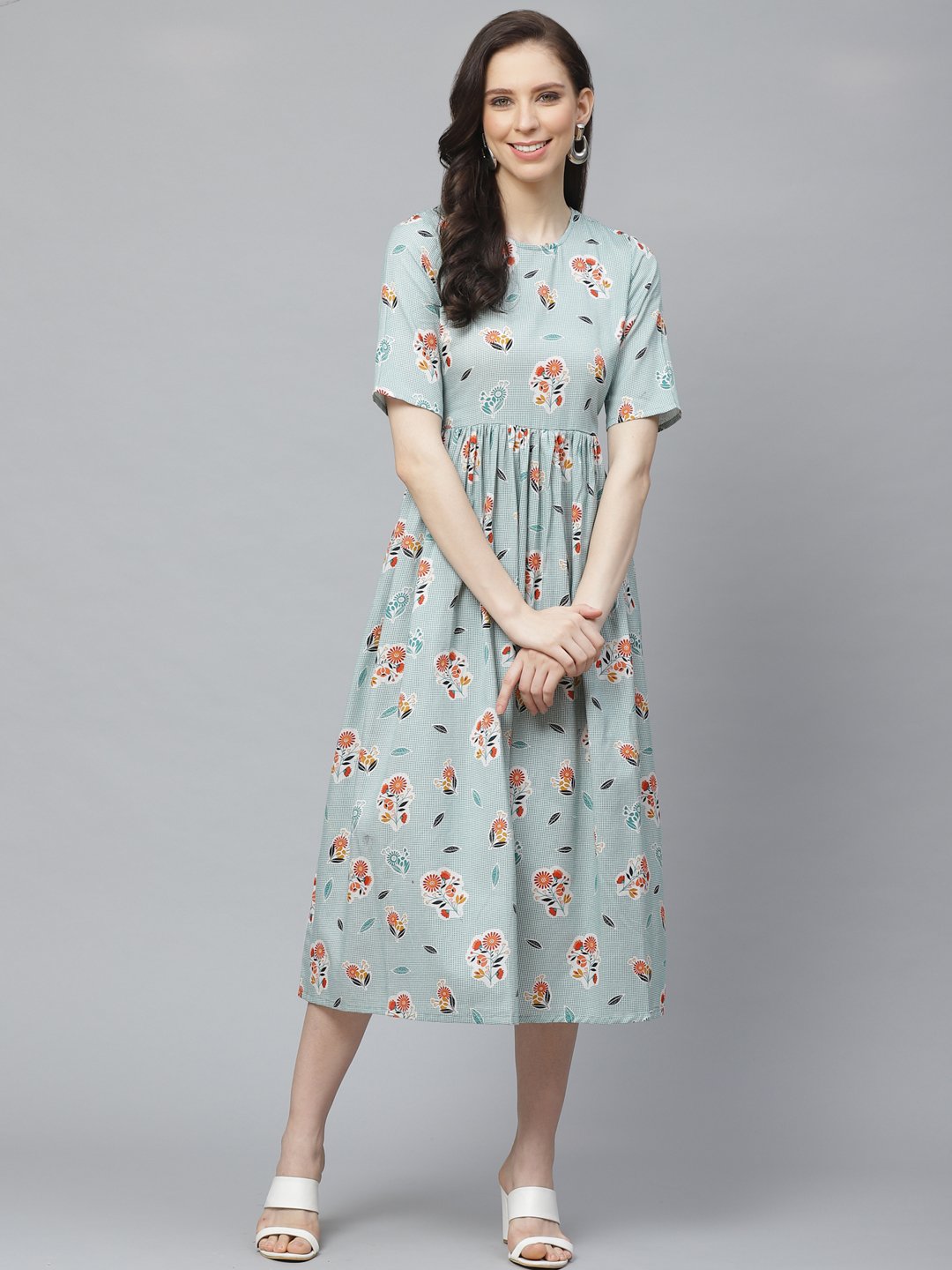 Women Turquoise Blue Floral Printed Round Neck Cotton A-Line Dress | LASVINI - Redefining Indian Fashion with Elegance