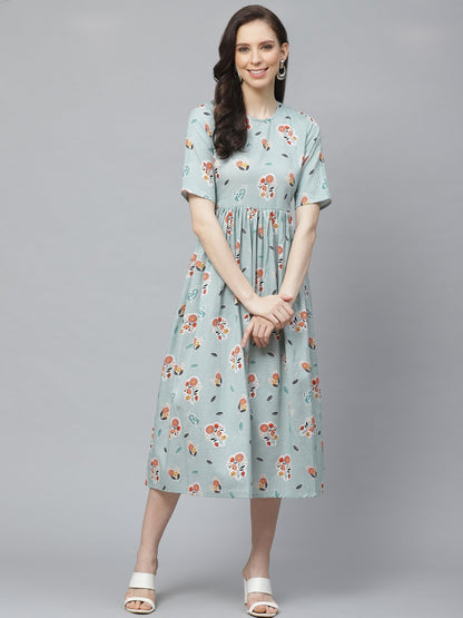 Women Turquoise Blue Floral Printed Round Neck Cotton A-Line Dress | LASVINI - Redefining Indian Fashion with Elegance