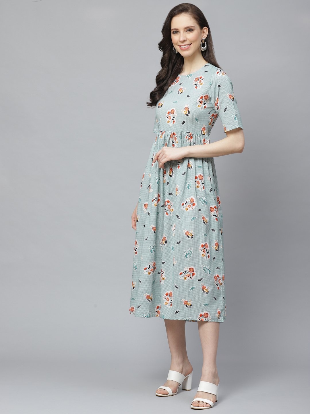 Women Turquoise Blue Floral Printed Round Neck Cotton A-Line Dress | LASVINI - Redefining Indian Fashion with Elegance