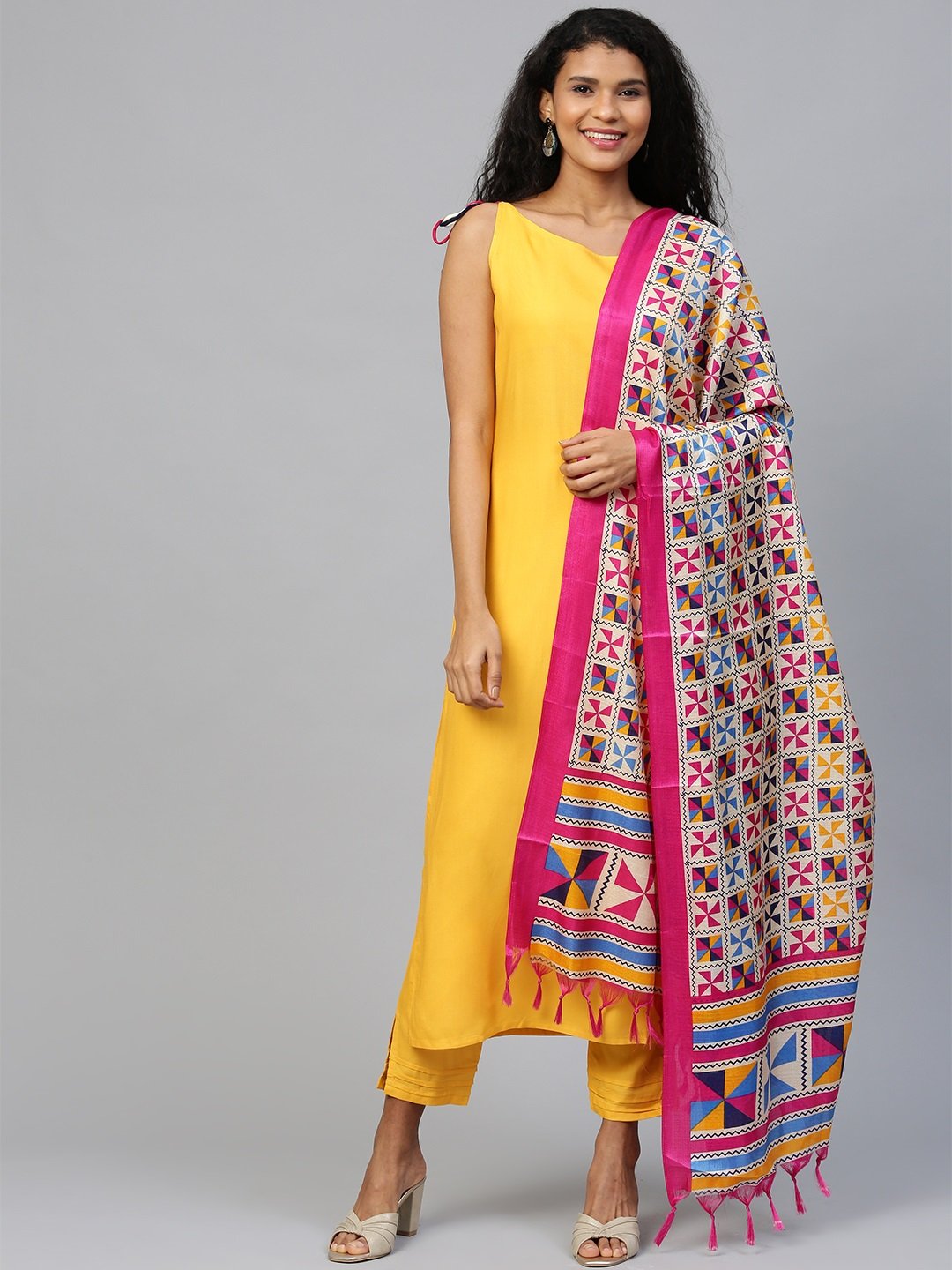 Women Mustard  Sleeveless Straight Kurta Trouser Dupatta Set | LASVINI - Redefining Indian Fashion with Elegance