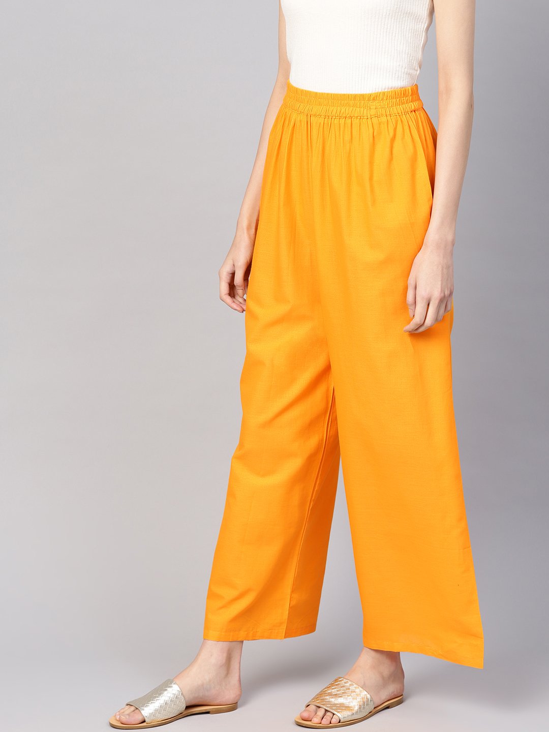 Women Orange Solid Wide Leg Palazzos | LASVINI - Redefining Indian Fashion with Elegance