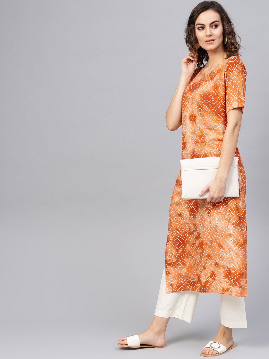 Women Rust Orange & White Bandhani Printed Straight Kurta | LASVINI - Redefining Indian Fashion with Elegance