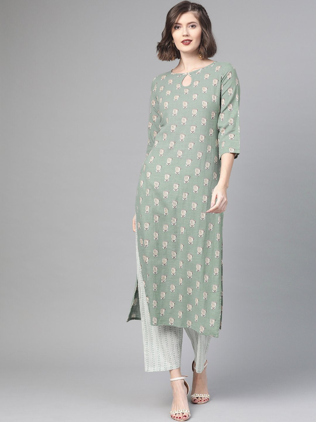 Women Green & Beige Straight Quirky Printed Kurta And Trousers Set | LASVINI - Redefining Indian Fashion with Elegance