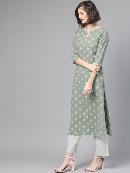 Women Green & Beige Straight Quirky Printed Kurta And Trousers Set | LASVINI - Redefining Indian Fashion with Elegance