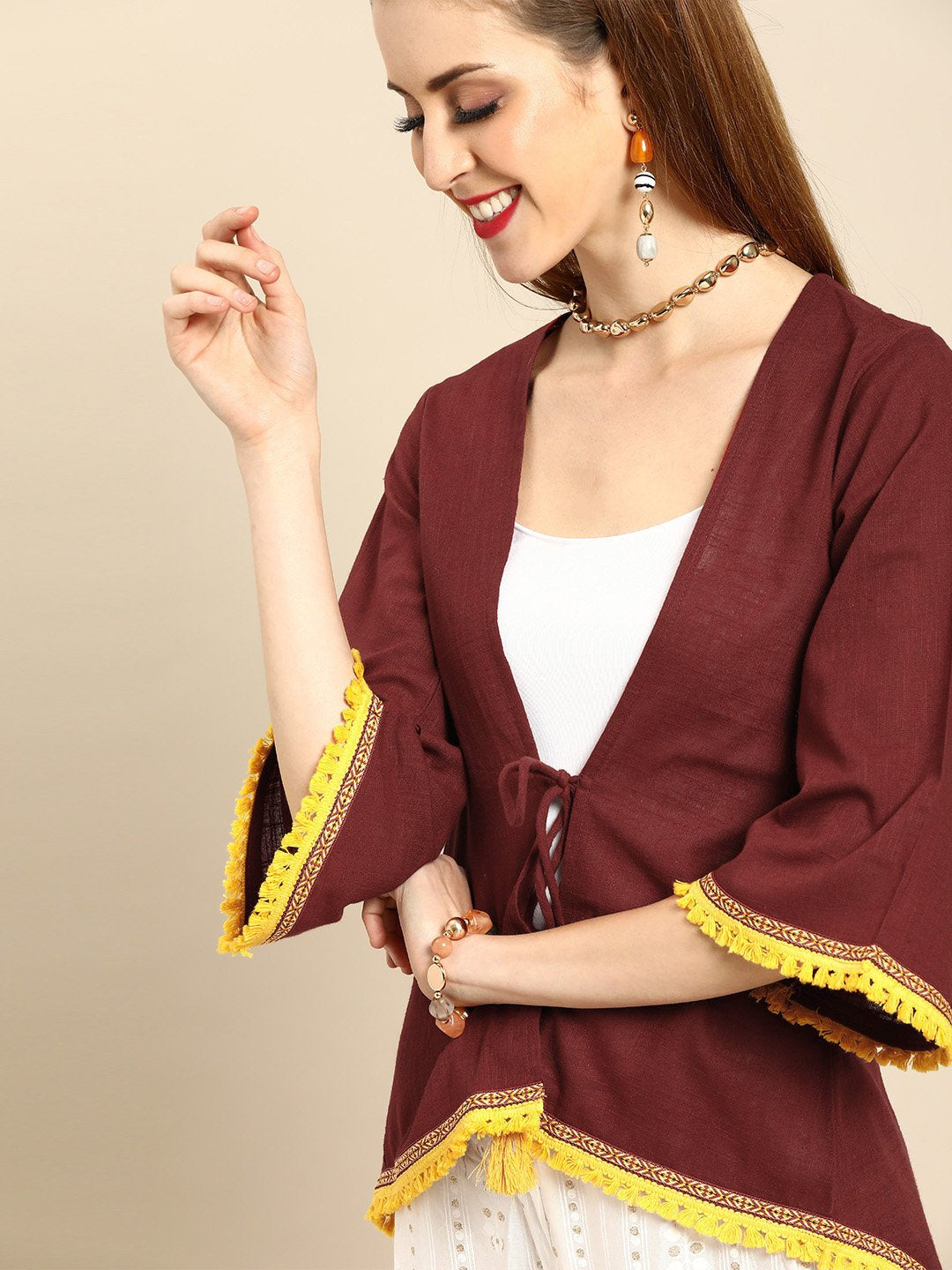 Women Solid Maroon Shrug With Tassle And Lace Detail | LASVINI - Redefining Indian Fashion with Elegance