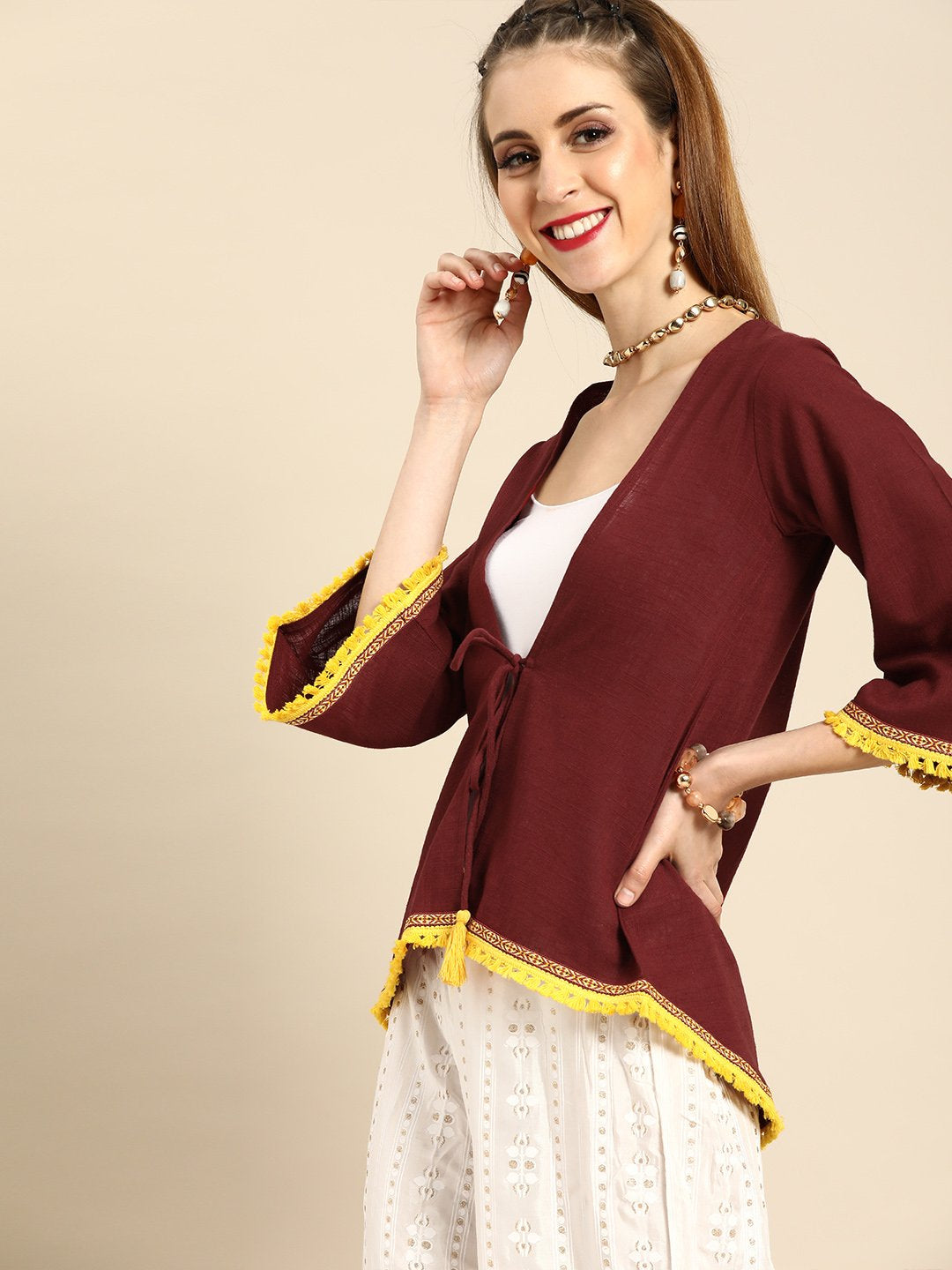 Women Solid Maroon Shrug With Tassle And Lace Detail | LASVINI - Redefining Indian Fashion with Elegance