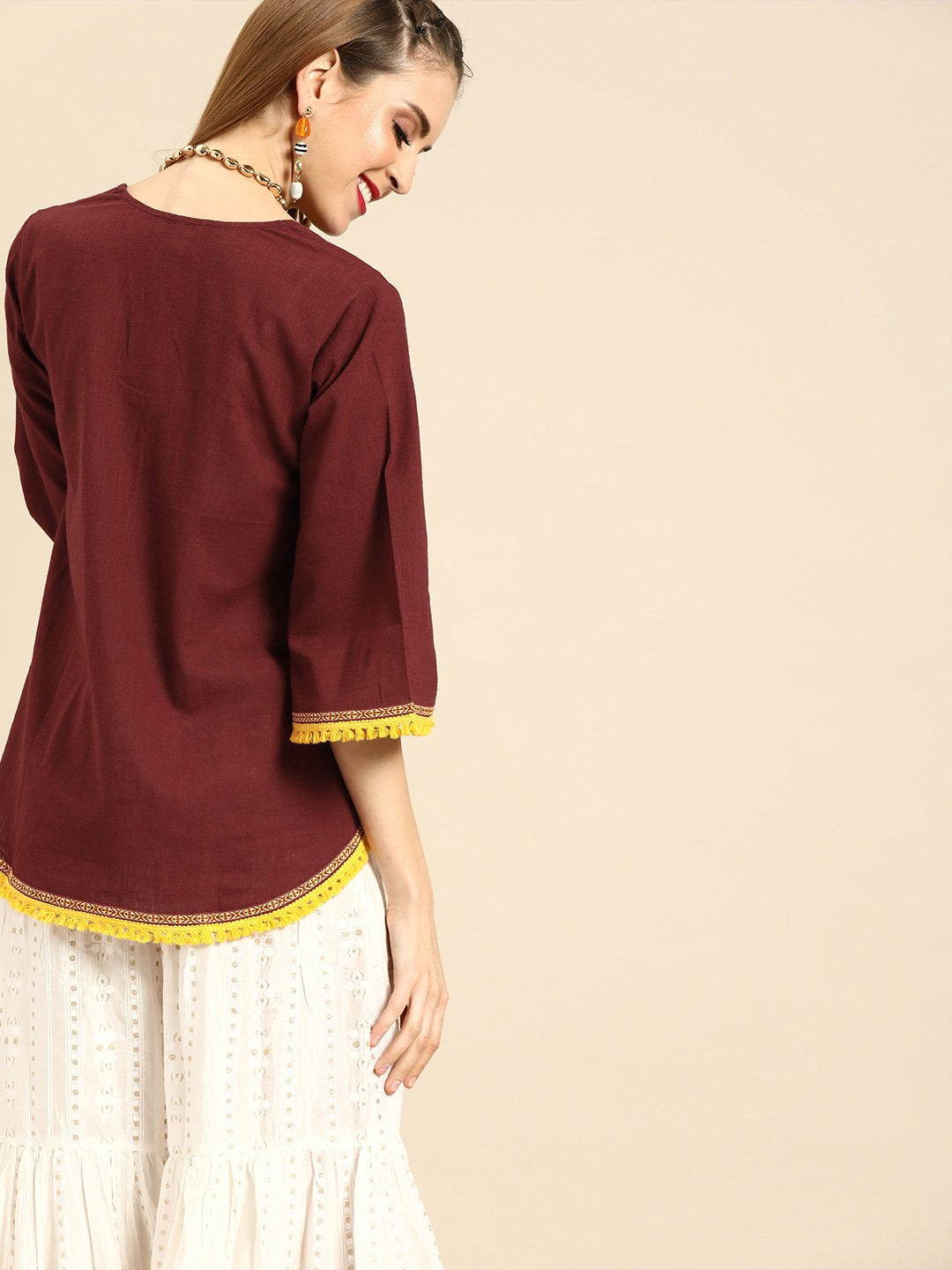 Women Solid Maroon Shrug With Tassle And Lace Detail | LASVINI - Redefining Indian Fashion with Elegance