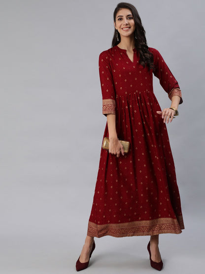 Women Maroon & Gold Printed Maxi Dress With Three Quarter Sleeves | LASVINI - Redefining Indian Fashion with Elegance