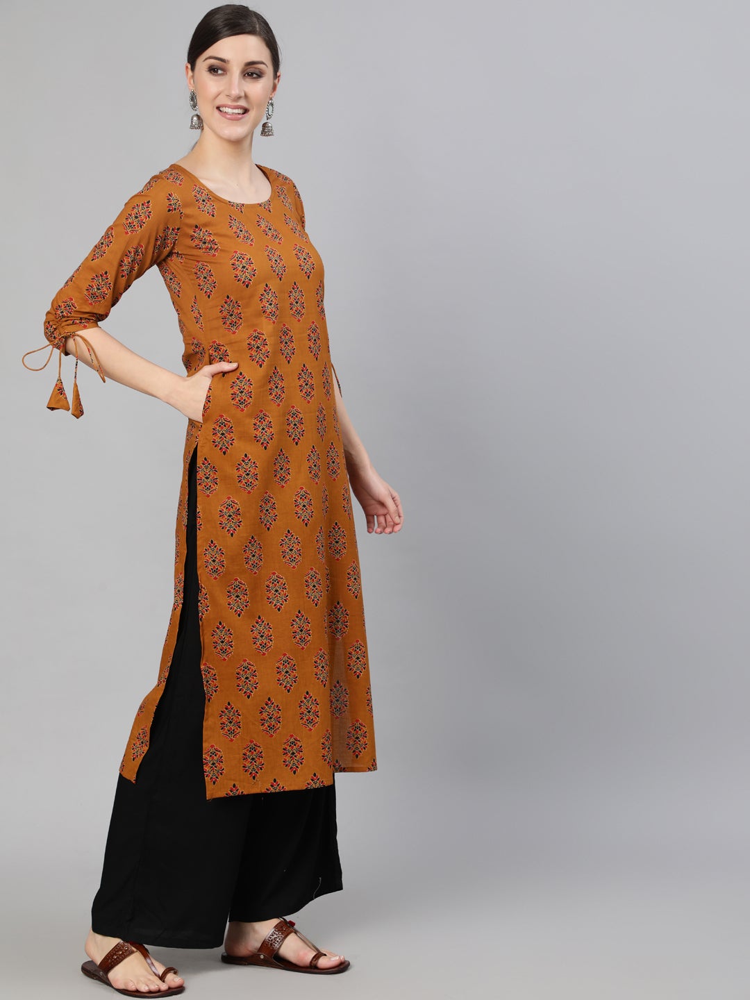 Women Mustard Ethnic Motifs Printed Straight Kurta With Tassel Detail | LASVINI - Redefining Indian Fashion with Elegance