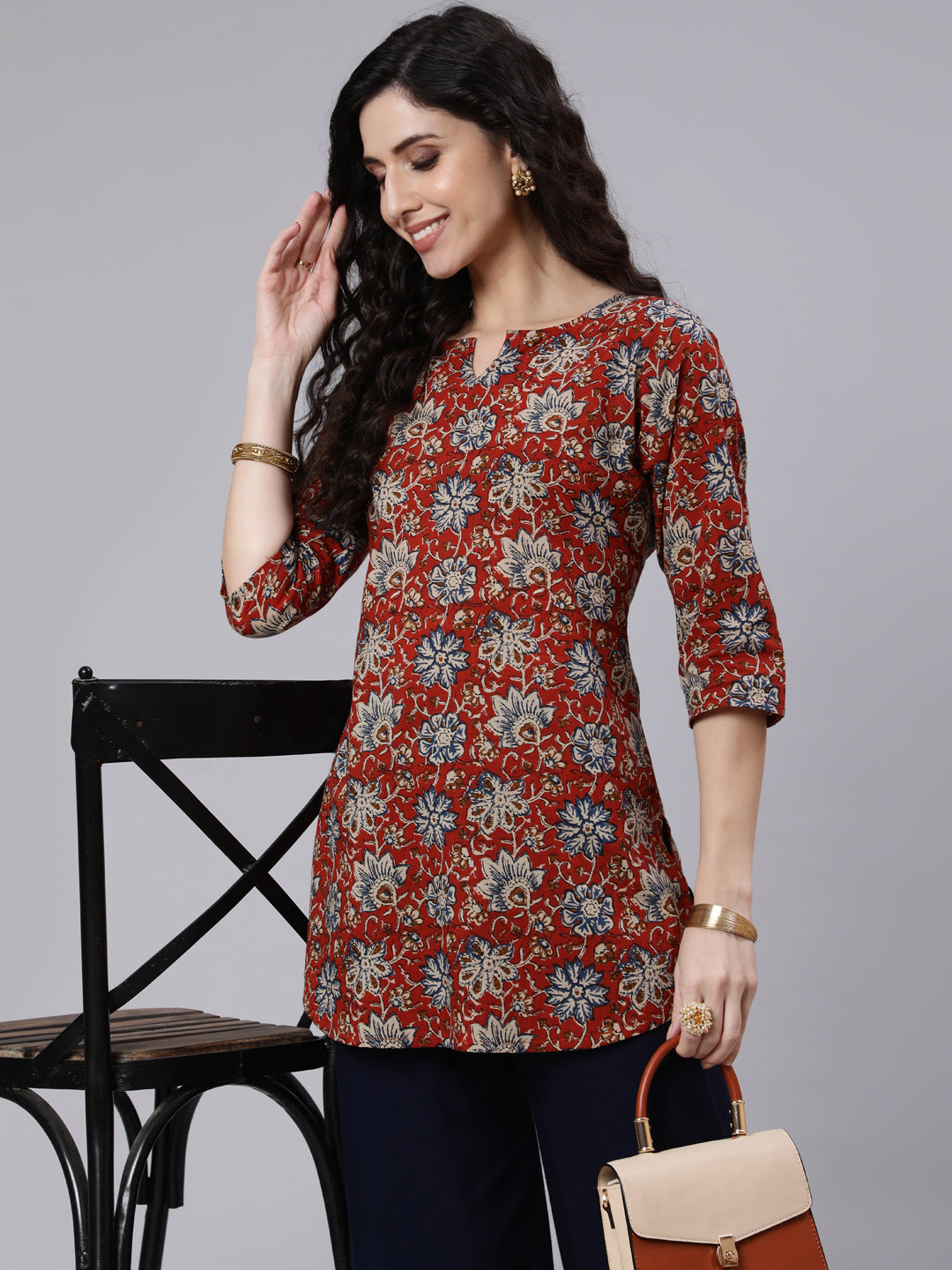 Women Rust Floral Printed Straight Tunic With Three Quarter Sleeves | LASVINI - Redefining Indian Fashion with Elegance