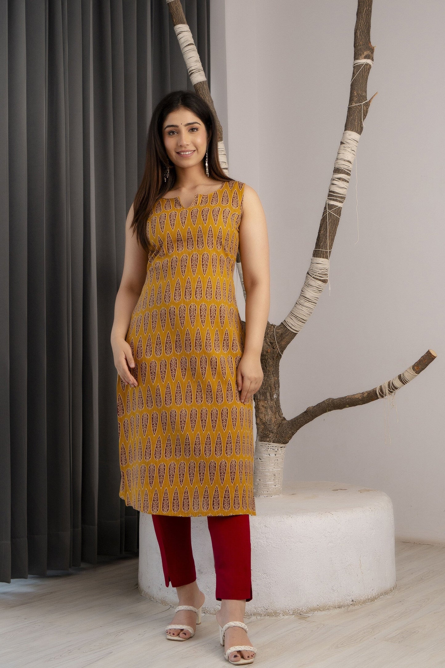 Women Mustard Printed Straight Sleeveless Kurta | LASVINI - Redefining Indian Fashion with Elegance