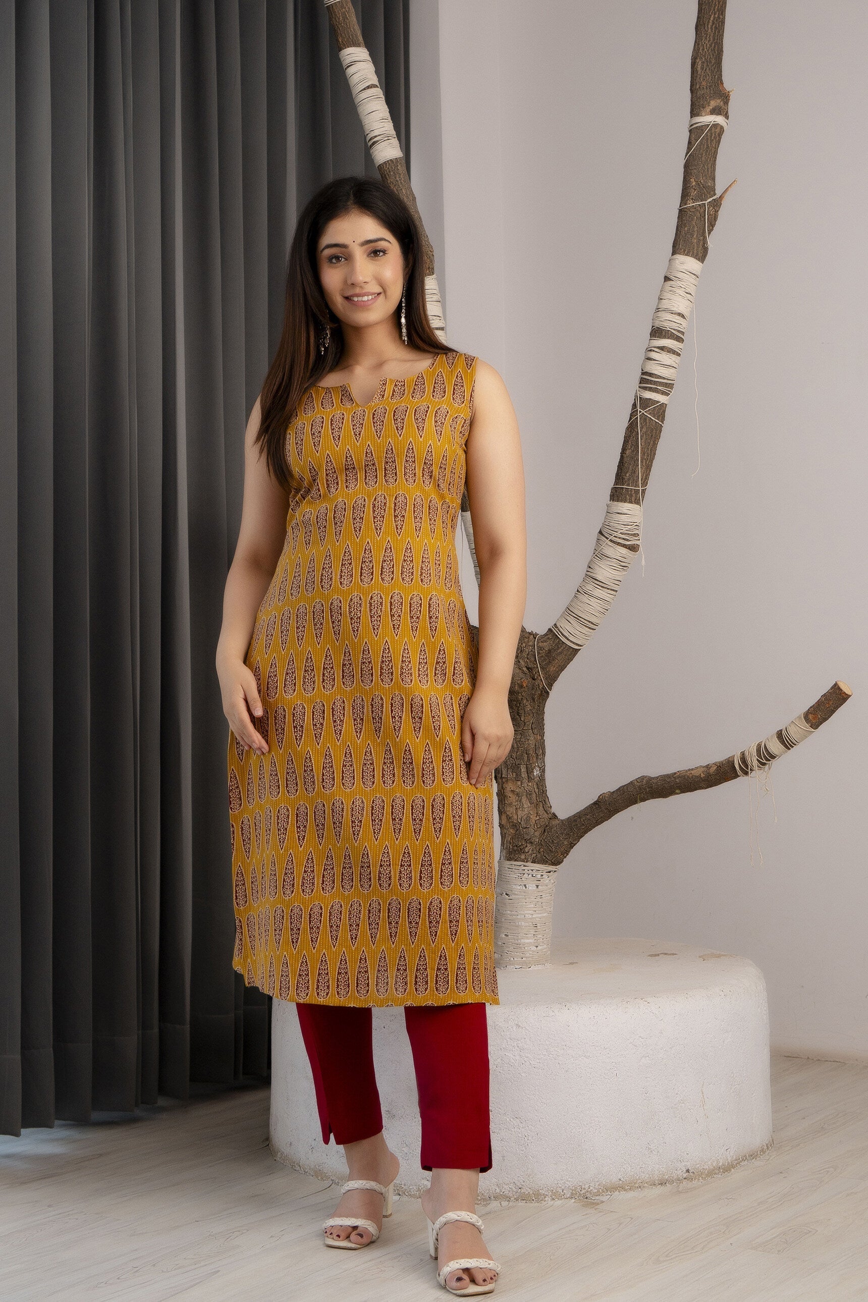 Women Mustard Printed Straight Sleeveless Kurta | LASVINI - Redefining Indian Fashion with Elegance