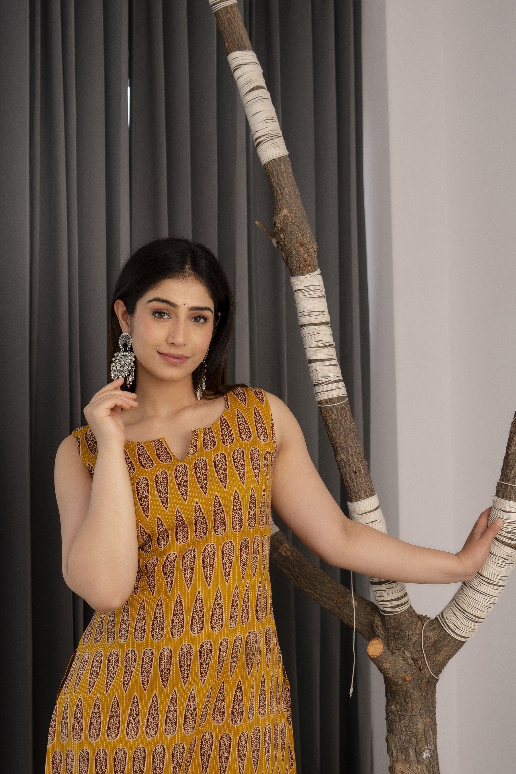 Women Mustard Printed Straight Sleeveless Kurta | LASVINI - Redefining Indian Fashion with Elegance