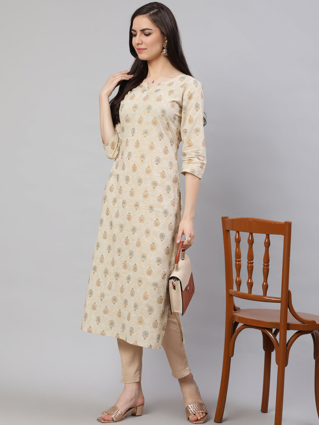 Women Cream Ethnic Printed Straight Kurta With Three Quarter Sleeves | LASVINI - Redefining Indian Fashion with Elegance