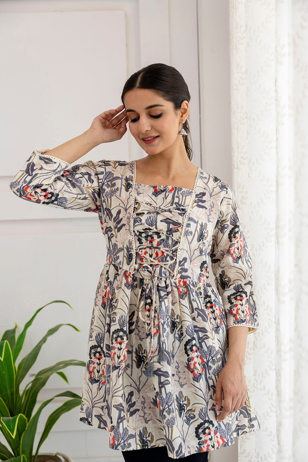 Women Off-White Printed V-Neck Peplum Tunic | LASVINI - Redefining Indian Fashion with Elegance