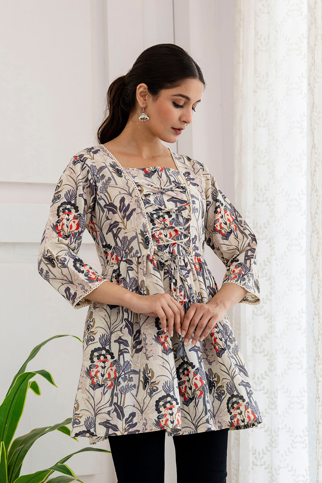 Women Off-White Printed V-Neck Peplum Tunic | LASVINI - Redefining Indian Fashion with Elegance